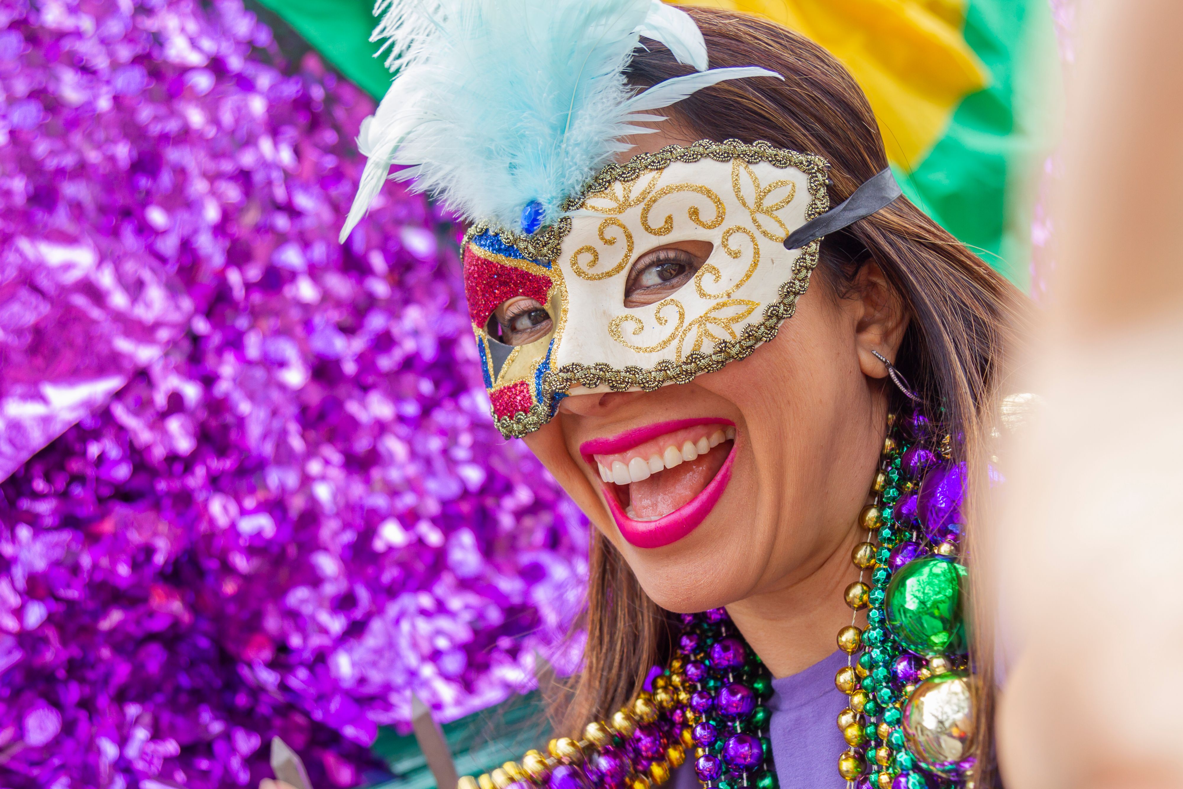 Woman wearing mardi gras mask